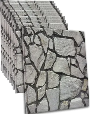 A stack of self-adhesive wall panels with a stone pattern.