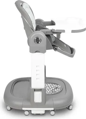 A side view of a gray and white baby high chair with a tray.