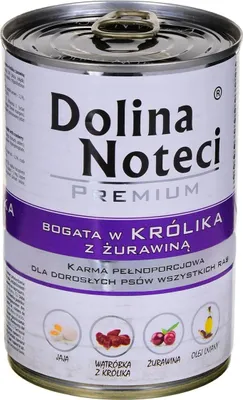 A can of dog food with product information and ingredient illustrations.