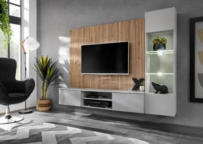 A modern living room with a wall-mounted entertainment unit.