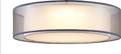 A close-up view of a drum-shaped pendant light fixture with a gray mesh shade and a white inner diffuser.