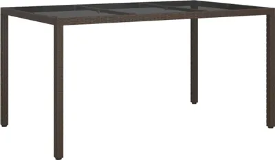 A brown rattan garden table with a black glass top, shown from a front-facing, slightly elevated angle.
