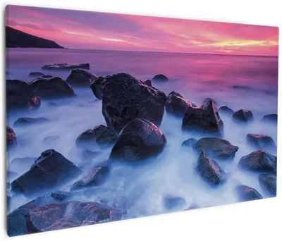 Produktbild von Wallario Premium Leinwandbild Felsen im Meer bei Sonnenuntergang in Größe 60 x 90 cm