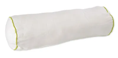 A white bolster pillow with green trim on a white background.