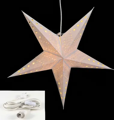 A white paper star lantern with small yellow star cutouts, illuminated from within, against a black background. A white power cord with a plug and switch is shown in the bottom left corner.
