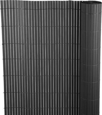 A rolled-up and unrolled fence screen made of vertical slats.