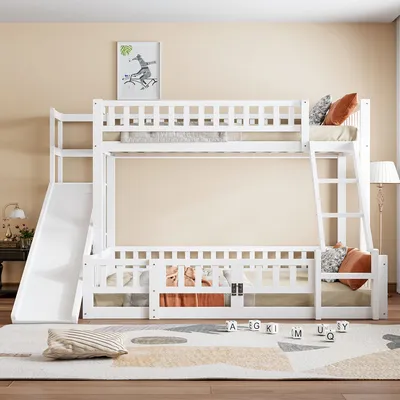 A white bunk bed with a slide and ladder is set up in a room with a neutral-colored wall and rug.