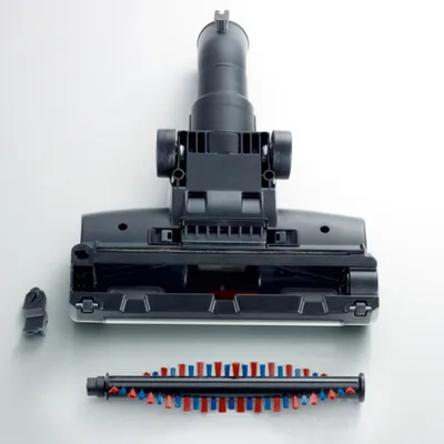 A vacuum cleaner brush head and its detachable roller brush, laid out on a white surface.