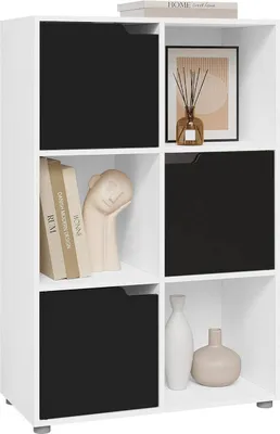A white cube shelf unit with black doors on some compartments, displaying decorative items and books.