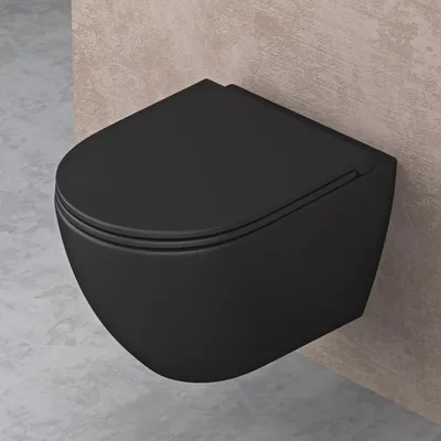 A black wall-mounted toilet is shown in a bathroom setting with concrete and beige textured walls.