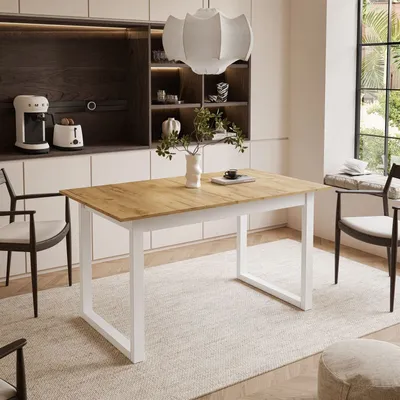 A dining table with chairs in a modern kitchen setting.
