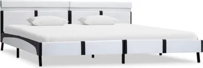 A white and black bed frame with two pillows on a white background.