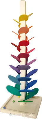 A wooden marble run toy with colorful discs.