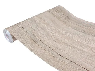 A roll of wood-grain patterned adhesive wallpaper is shown against a white background.