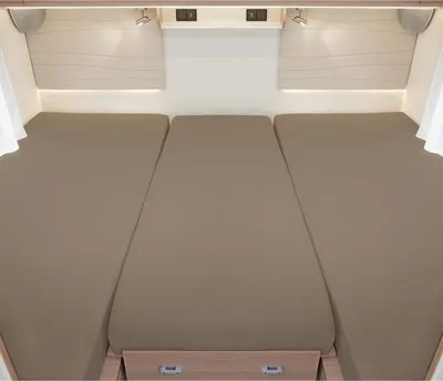 Three beds in a camper or RV, likely a convertible dinette area.