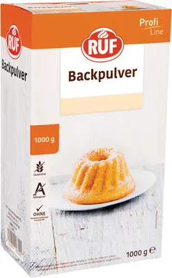 A product package for baking powder, with an image of a cake.