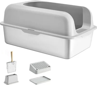 A white enclosed cat litter box with a scoop and other accessories displayed below it against a white background.
