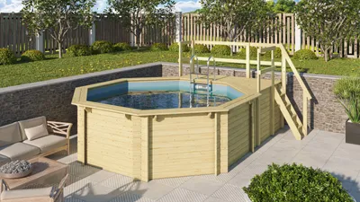 An octagonal wooden above-ground swimming pool with a wooden deck and steps, set in a backyard with a patio and garden furniture.