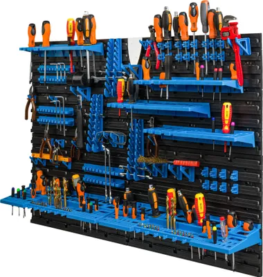 A wall-mounted tool organizer filled with various tools.