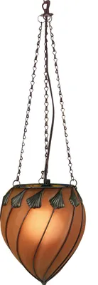 A hanging lamp with an orange glass shade and decorative metal accents.