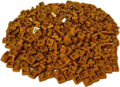 A pile of small gold LEGO bricks.