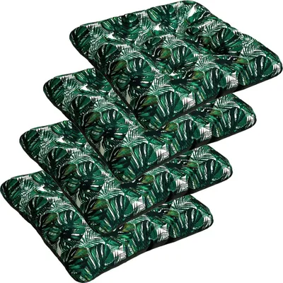 A stack of four square seat cushions with a tropical leaf pattern.
