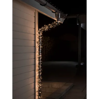 Produktbild von Konstsmide 3649-110 Micro LED Lichterkette, 1200 warm weiße Dioden, 24V Außentrafo, schwarzes Kabel