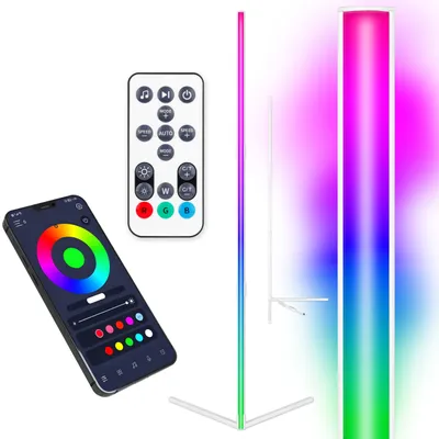 A flat lay of a smartphone displaying a color wheel app, a remote control, and a tall LED floor lamp with a gradient of colors.