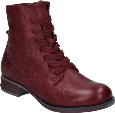 A single red leather boot is shown against a white background.