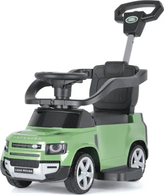 A green Land Rover Defender ride-on toy car with a push handle and steering wheel, isolated on a white background.