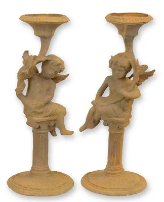 Productafbeelding van A Pair Of Rusty Cast Iron Putti Candlestands