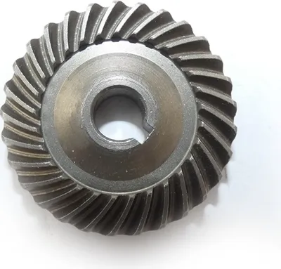 A close-up, top-down view of a single metal gear.