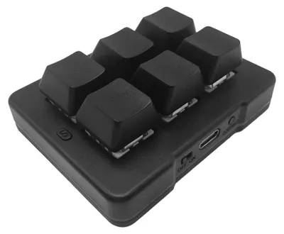 A black, six-key mechanical macro pad is shown from a slightly elevated angle against a white background.