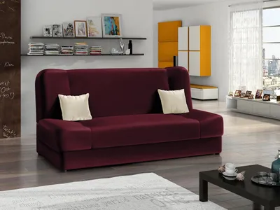 A living room with a burgundy sofa as the main focus.