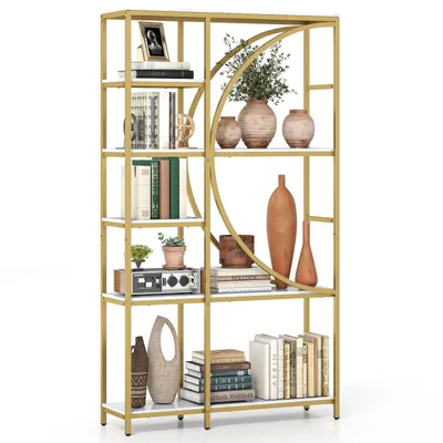 A gold and white bookshelf filled with decorative items and books.
