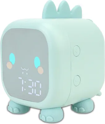 A cute mint green dinosaur-shaped alarm clock with a digital display showing 7:30.