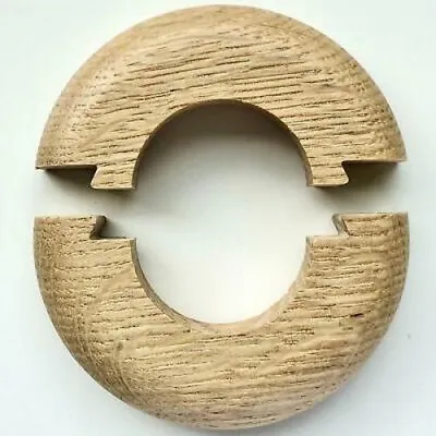 Two wooden pieces of a radiator rosette are shown against a white background.