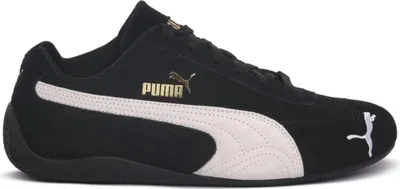 A side view of a black Puma Speedcat OG shoe with white accents and gold branding.