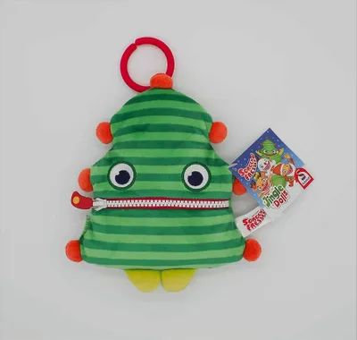 A plush toy shaped like a Christmas tree with a zipper mouth and a tag attached.