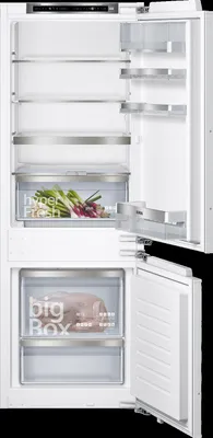 An open refrigerator with shelves and drawers visible.