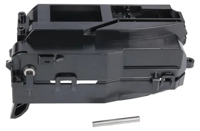 A black plastic component, likely a part for a robot vacuum cleaner, is shown against a white background. A small metal pin is placed in front of the component.