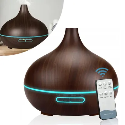 A product shot of an aroma diffuser with a remote control.