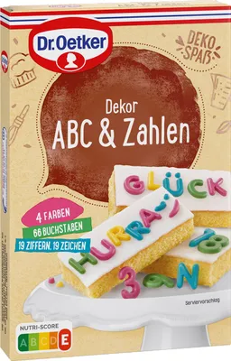 A product box for Dr. Oetker ABC & Zahlen cake decorations, showing examples of decorated cakes.