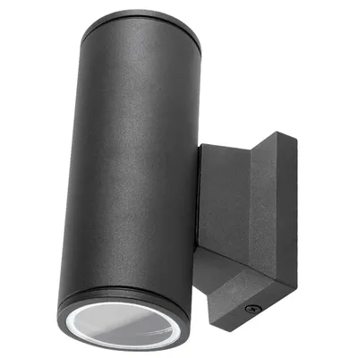 A black cylindrical LED wall light mounted on a wall.