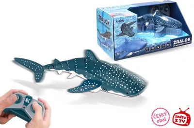 A remote-controlled shark toy is shown with its packaging and a remote control.