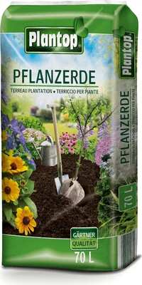 A bag of plant soil with a garden scene depicted on it.