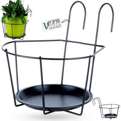 A black metal balcony railing planter holder with a green potted plant in the upper left corner and a smaller version of the planter in the lower right corner.