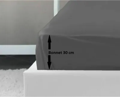 A close-up of a dark gray fitted sheet on a bed, with a measurement indicator showing 'Bonnet 30 cm'.
