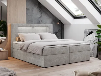 A modern bedroom with a large bed, skylights, and minimalist decor.