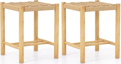 Two wooden bar stools with woven seats are shown against a white background.